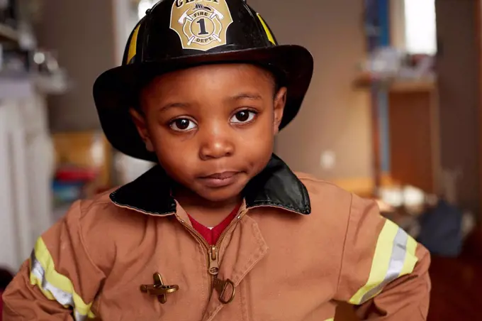 Black boy wearing firefighter Halloween costume