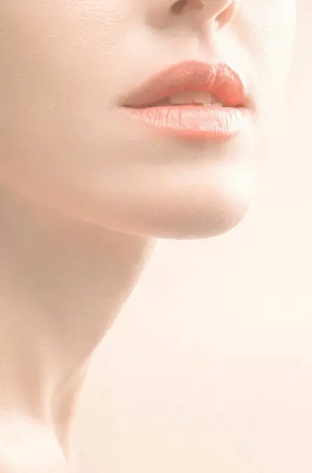 Close up of mouth, chin and neck of woman