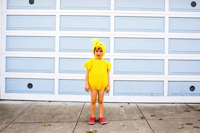 Mixed race boy wearing costume