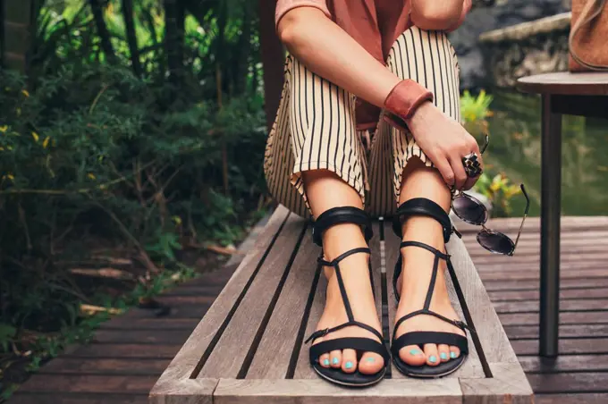 Caucasian woman sitting on bench