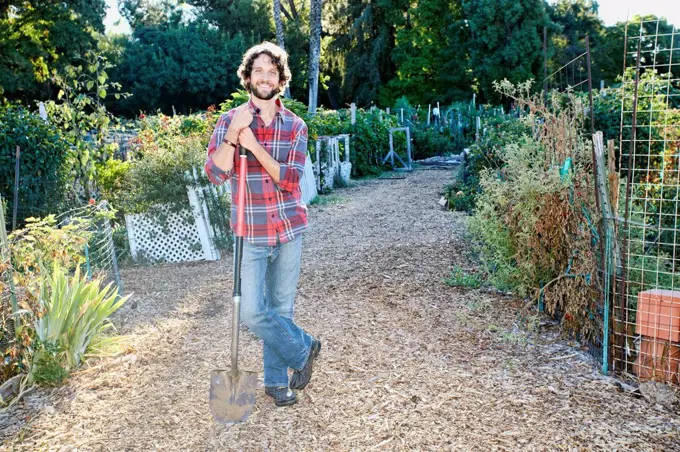 Caucasian man standing in garden