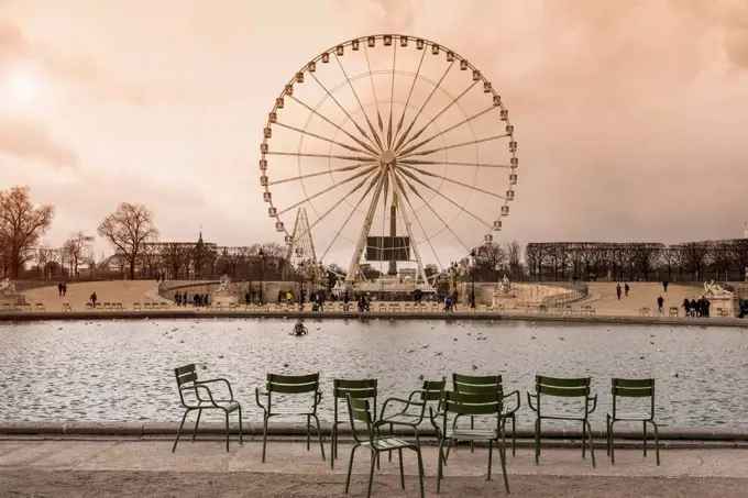 Tourists walking near ferris wheel, Paris, Ile-de-France, France,