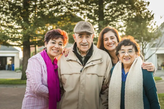 Hispanic Multi-generation family smiling outdoors