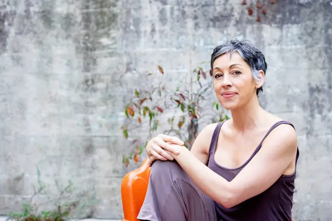 Older Caucasian woman sitting outdoors