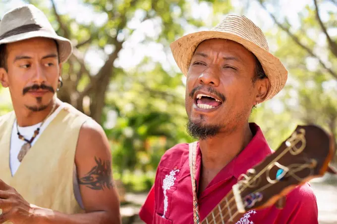 Hispanic musicians performing in park