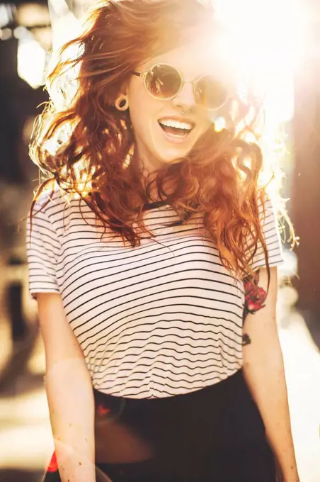 Caucasian woman jumping for joy outdoors