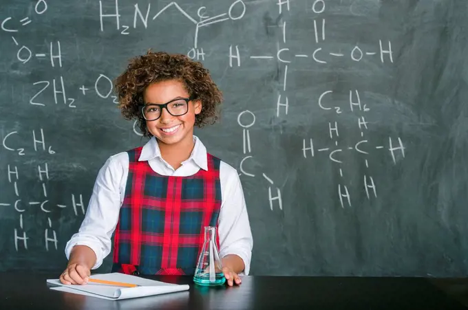 Mixed race student doing experiment in science class