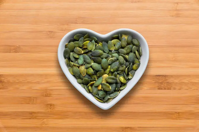 Heart-shaped bowls of heart-healthy seeds