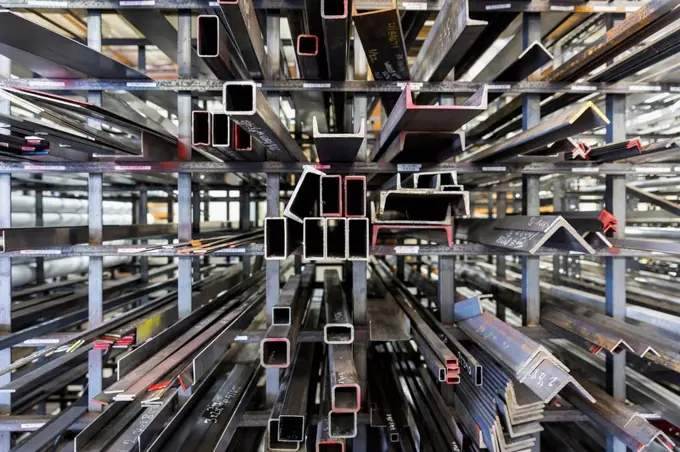 Metal parts on racks in warehouse