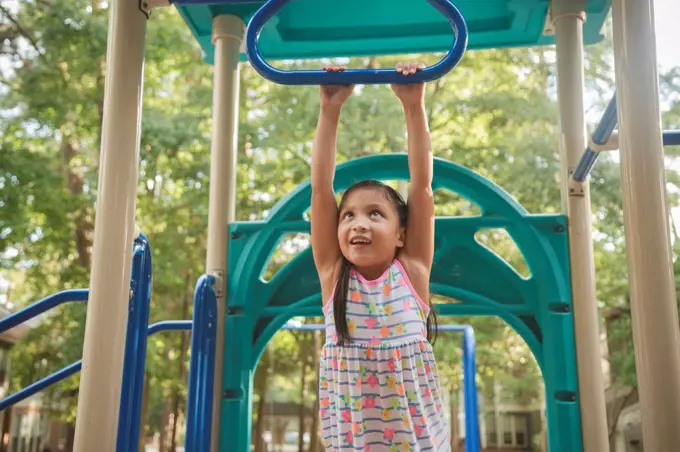 Hispanic playing on playground