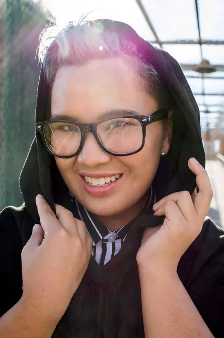 Portrait of smiling androgynous Asian woman