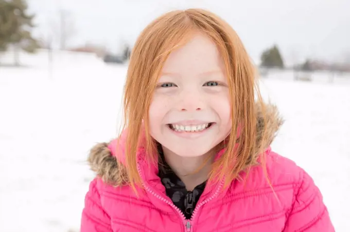 Portrait of smiling girl in winter