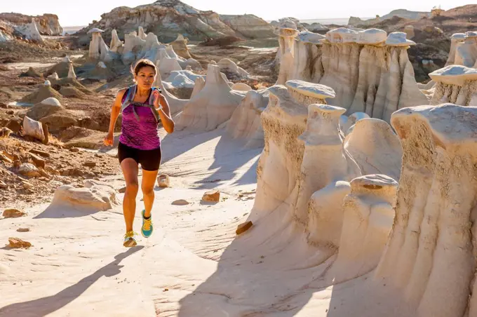 Native American woman running in desert