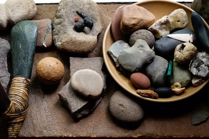 Stones in bowl and traditional tools