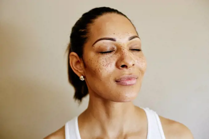 Close up of mixed race woman with eyes closed