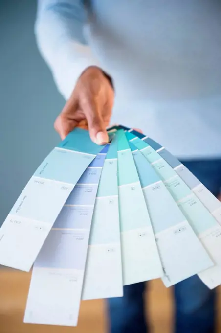 Cape Verdean woman holding color swatches