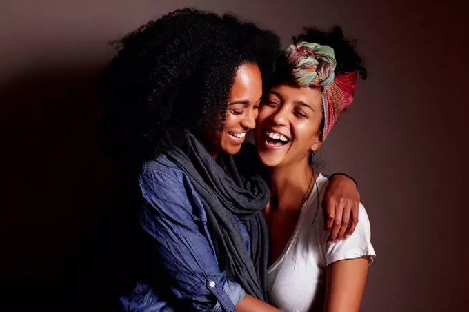 Smiling women hugging