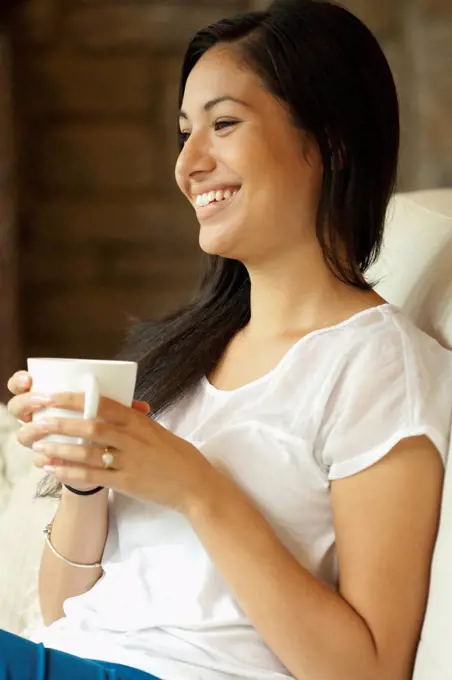 Woman having cup of coffee