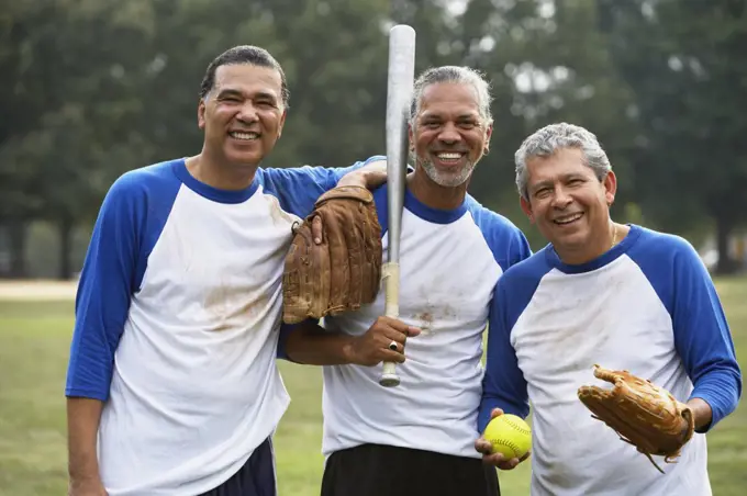 Multi-ethnic men with baseball gear