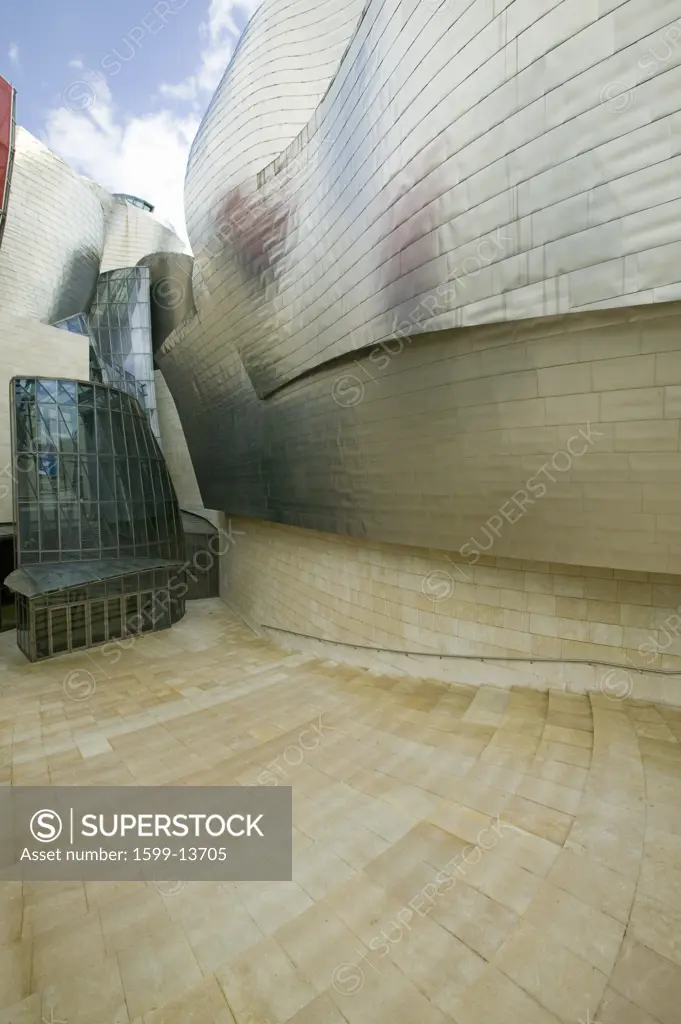 Front entrance of the Guggenheim Museum of Contemporary Art of Bilbao (Bilbo), located on the North Coast of Spain in the Basque region. Nicknamed 'The Hole', this is a contemporary museum built of titanium, limestone and glass and was designed by Canadian citizen, Frank O. Gehry in 1997.