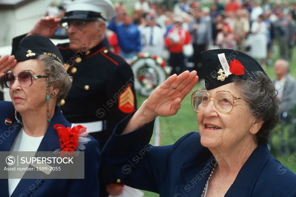 World War II Women Veterans saluting at ceremony at Veteran's National Cemetery, Los Angeles, California