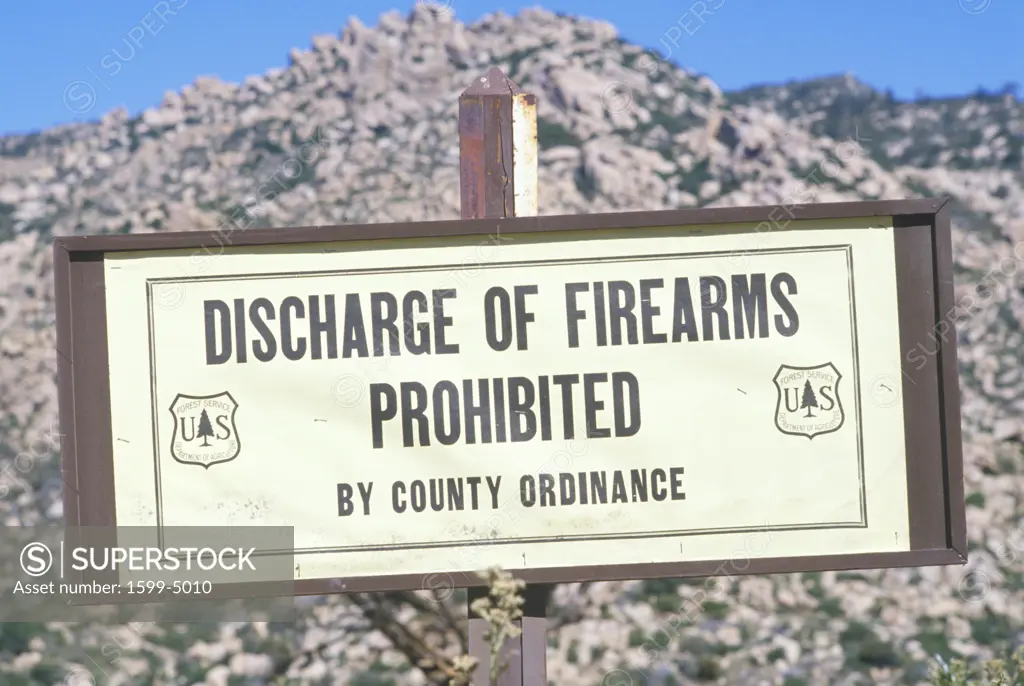 A sign that reads Discharge of firearms prohibited”