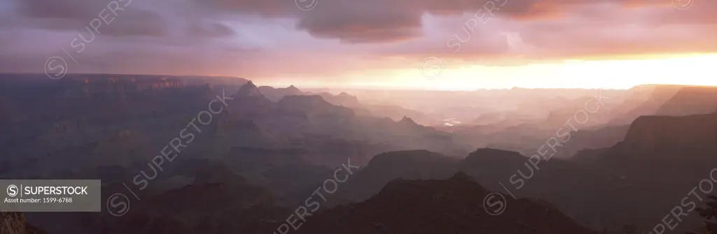 This is the south rim of the Grand Canyon known as Grand View Point.  Also in view is the Colorado River at sunrise.