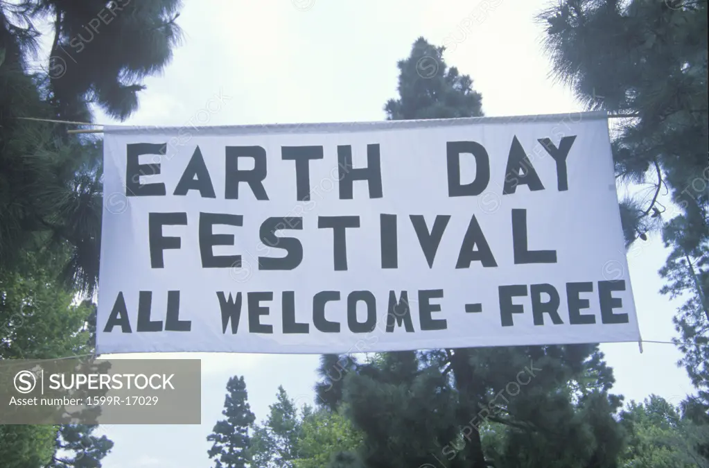 A hanging sign welcoming people to the Earth Day Festival