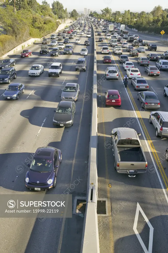 Diamond car pool lane on bottom right of 405 freeway near Sunset Blvd. at rush hour, Los Angeles, California