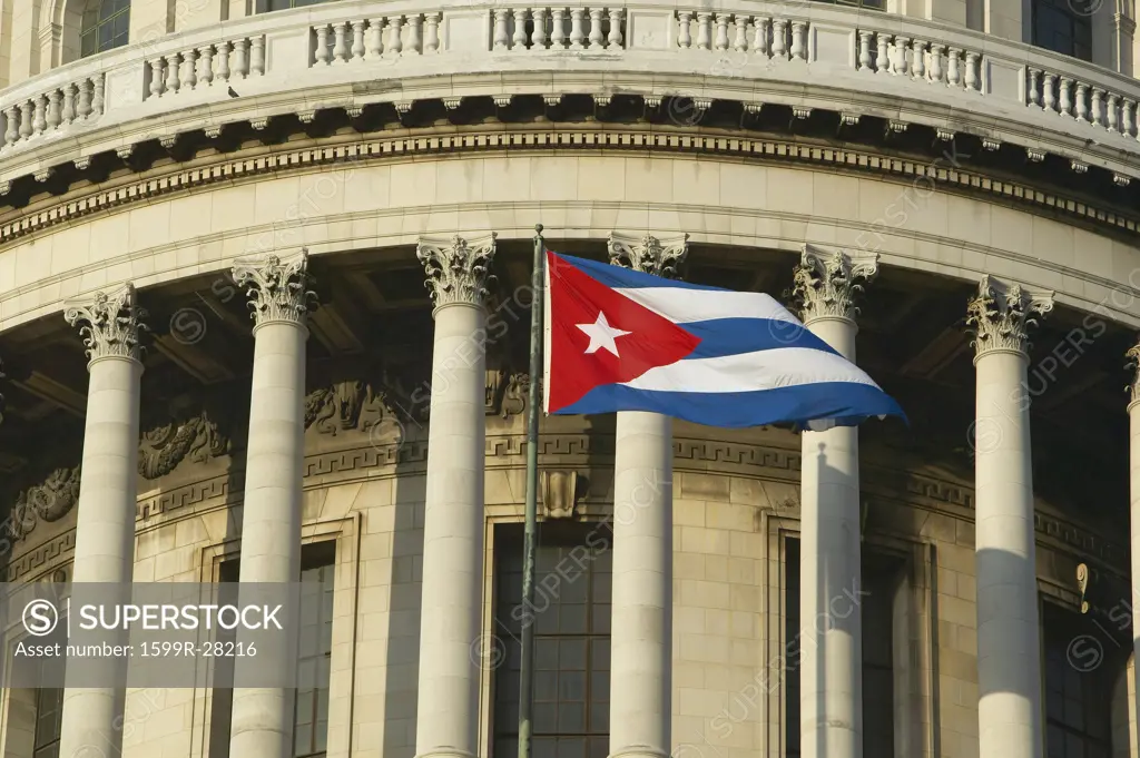 The Capitolio and Cuban Flag, the Cuban capitol building and dome in Havana, Cuba