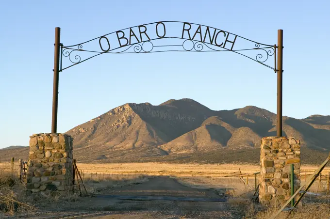 O'Bar'o Ranch gate and mountains at sunset in central New Mexico, Route 48 near Smokey Bear Historical Park