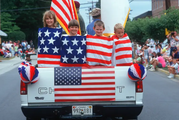 Children wrapped in an American flag for an Independence Day Parade, East Shore, MD