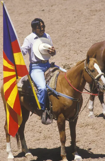 Native American on horseback at opening ceremonies at Inter-Tribal Indian rodeo