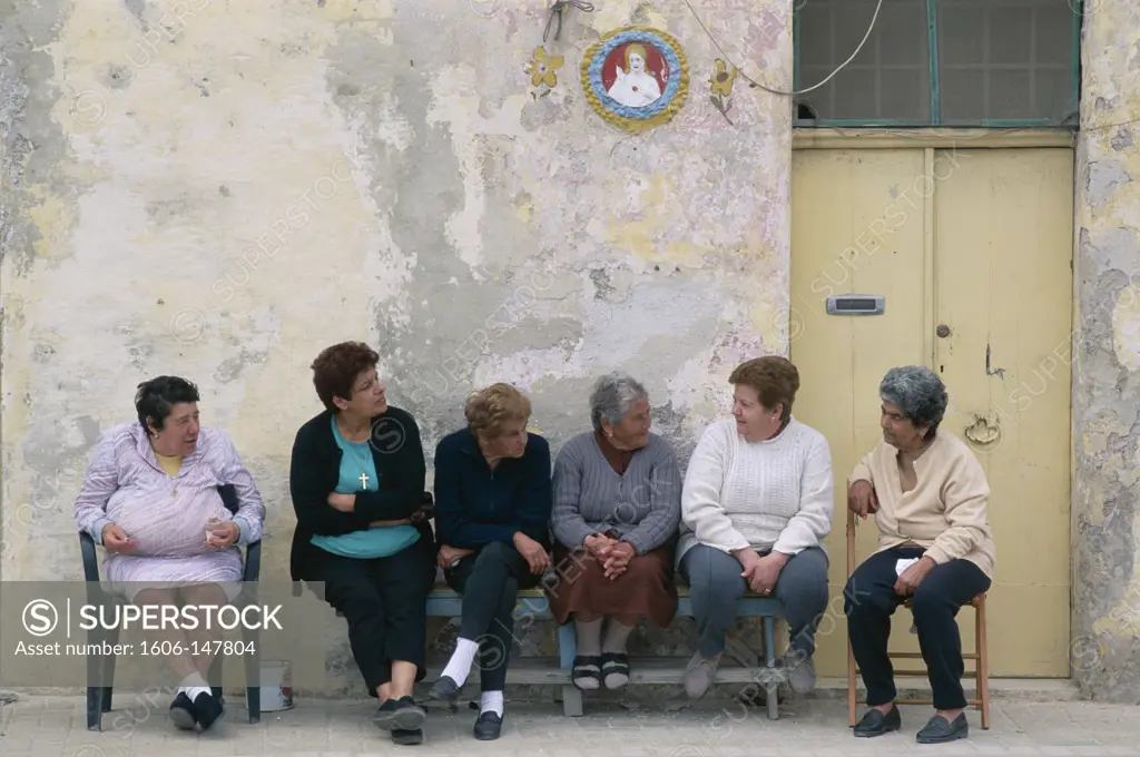 Malta, Marsaxlokk, Street Scene / Group of Elderly Local Women