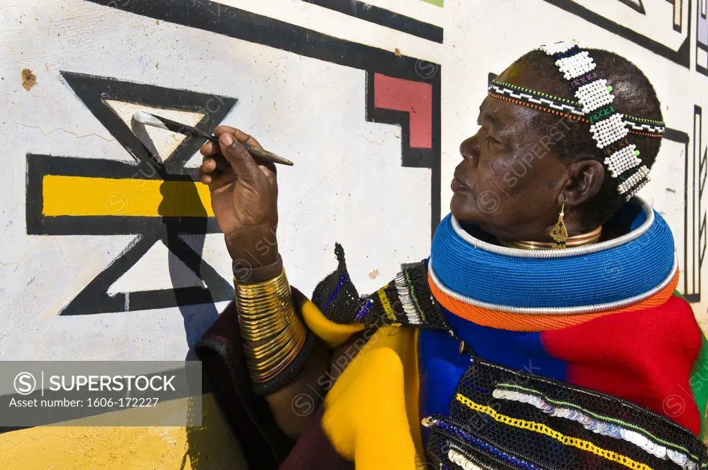 Africa, South Africa, Mpumalanga Province, KwaNdebele, Ndebele tribe, Mabhoko village, the artist Francina Ndimande painting her walls