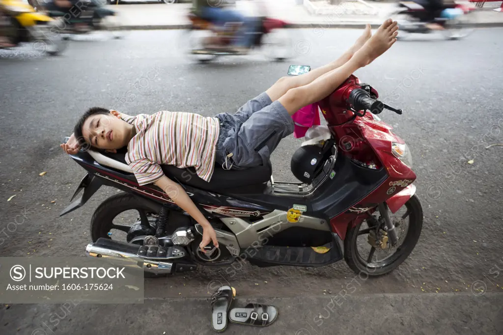 Vietnam,Vietnam,Ho Chi Minh City,Boy Sleeping on Motorbike