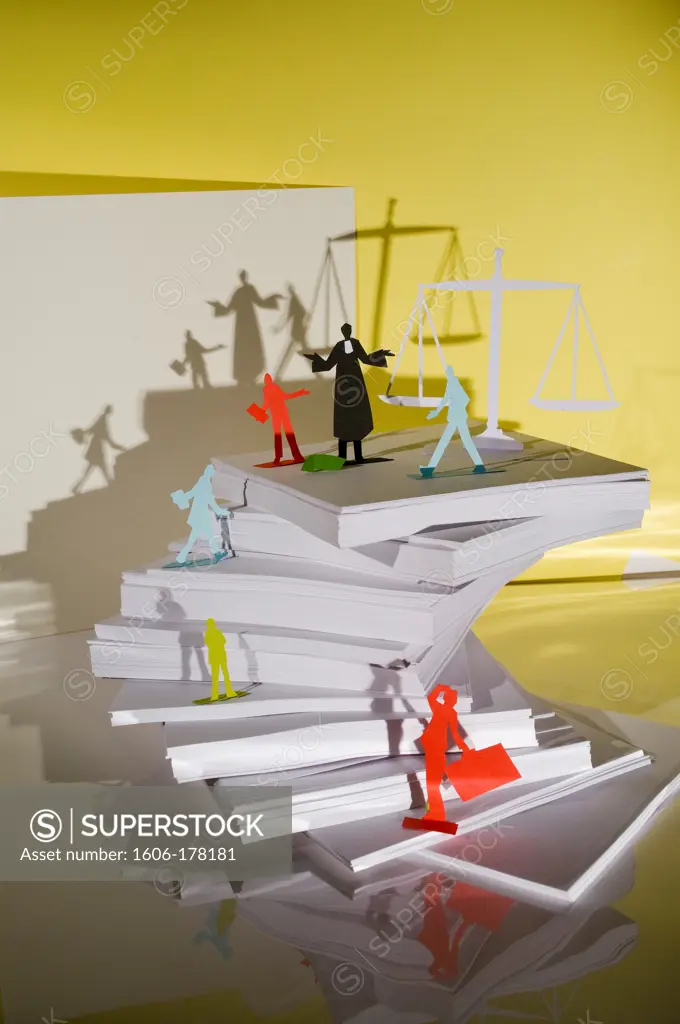 The classification of lawyers, 6 men and 1 lawyer on a pile of paper in front of a balance