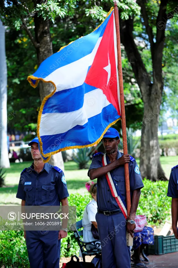 Policeman Holding A Flag In Havana, Cuba