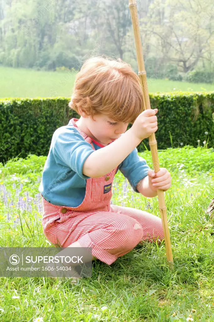 Little boy playing in the garden