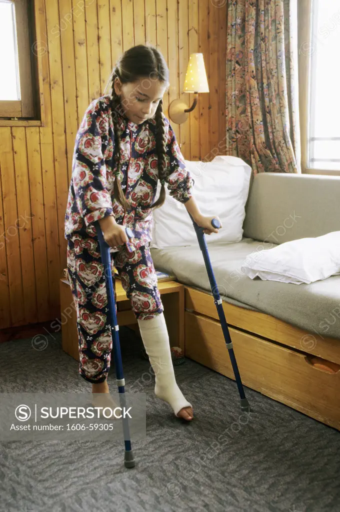 Little girl, brocken leg, walking with crutches