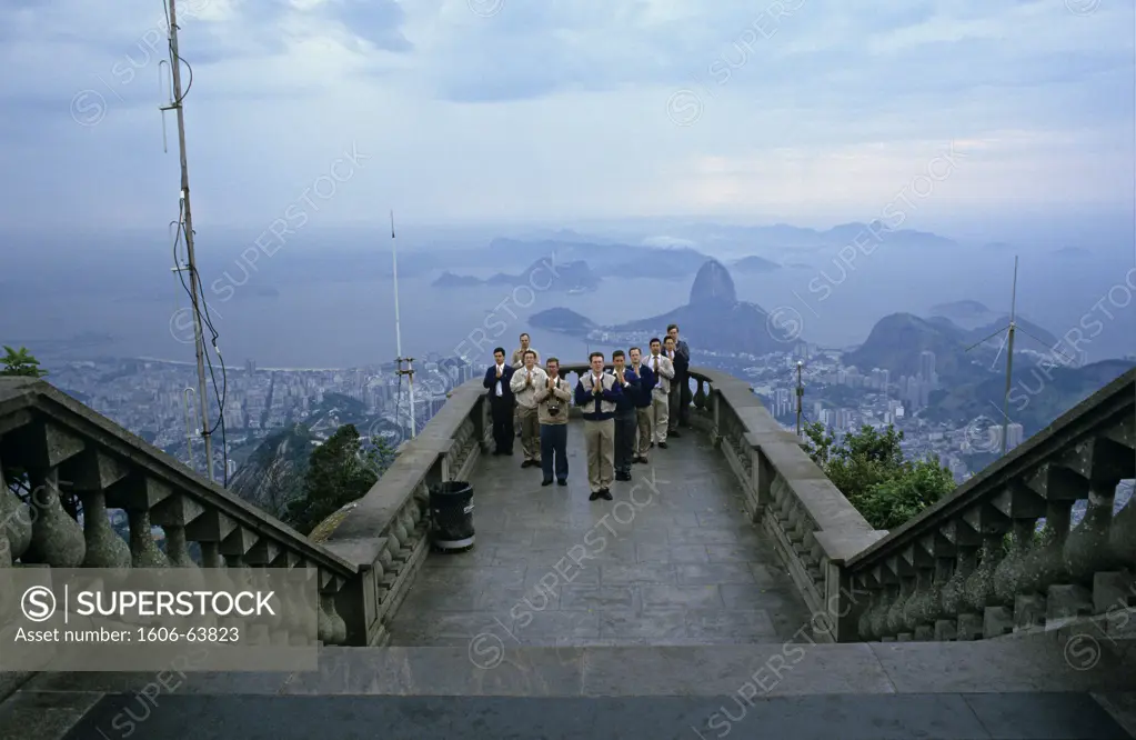 Brazil, Rio-de-Janeiro, pilgrims praying in front of the Corcovado Christ