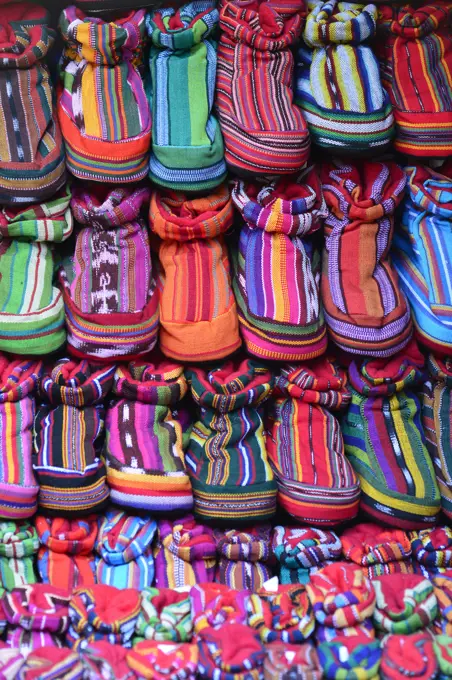 Multi-colored leather shoes in Chichicastenango market , Guatemala, Central America.