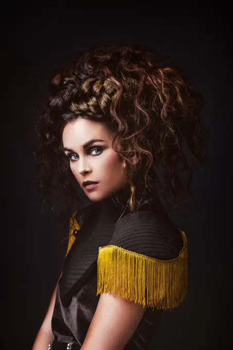 Portrait of a glamorous young woman in profile with a vintage dress.