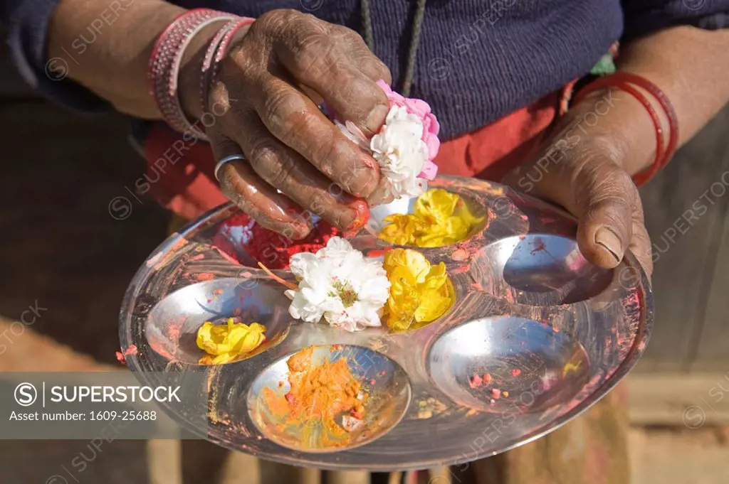 Nepal, Tanahun, Dumre, Ancient Newari mountain village of Bandipur, Old woman at shrine