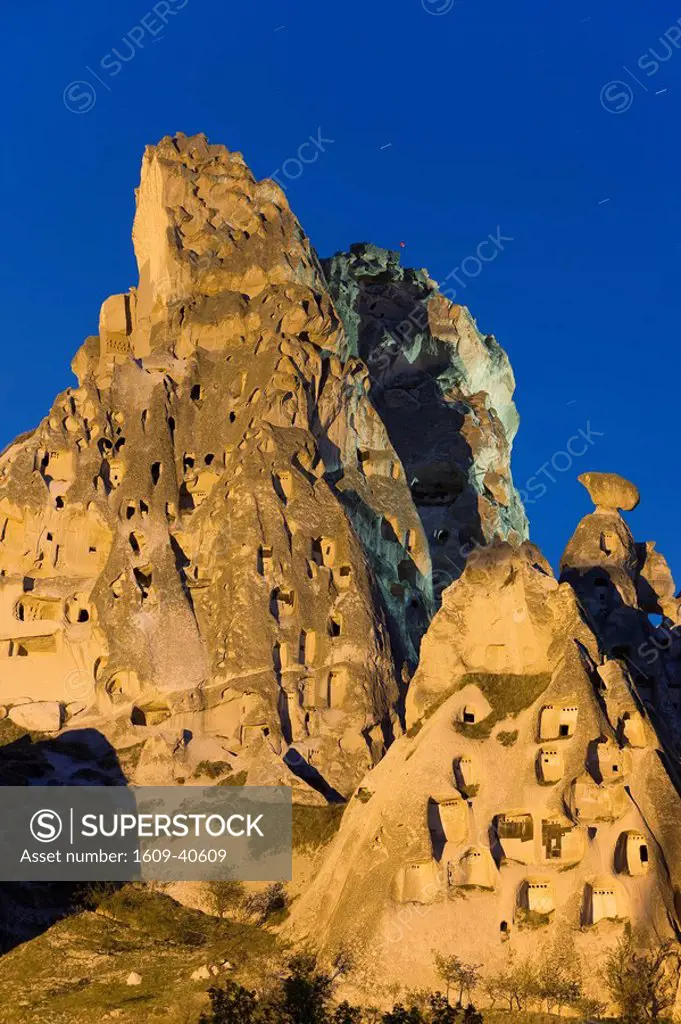 Old troglodytic cave dwellings cut into the rock Castle, Uchisar, Cappadocia, Anatolia, Turkey