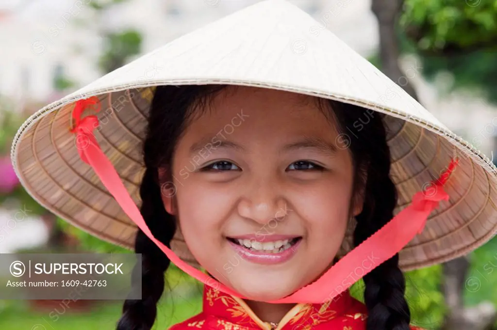 Vietnam, Ho Chi Minh City, Girl Dressed in Traditional Vietnamese Costume