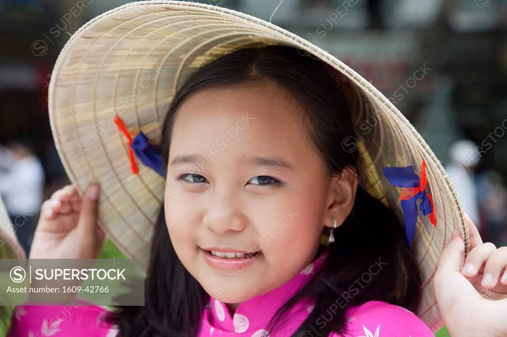 Vietnam, Ho Chi Minh City, Girl Dressed in Traditional Vietnamese Costume