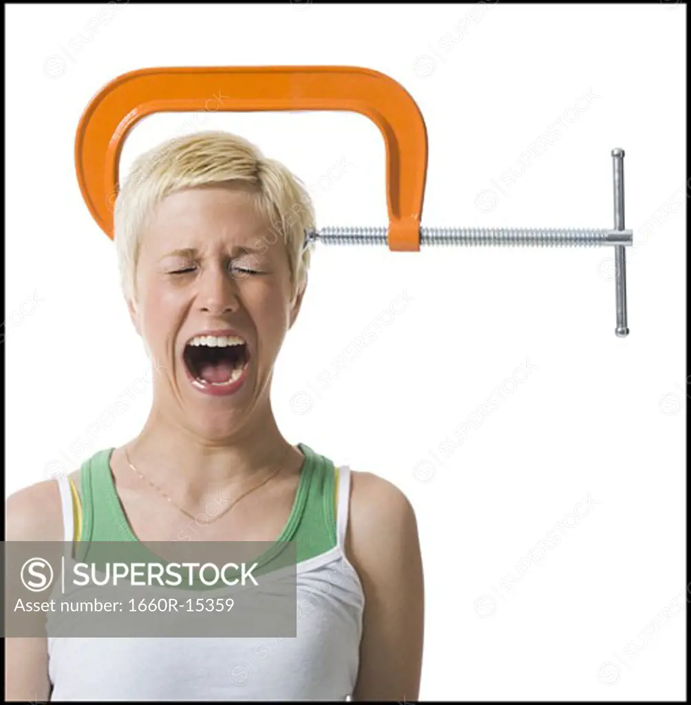 Screaming woman with c-clamp on head