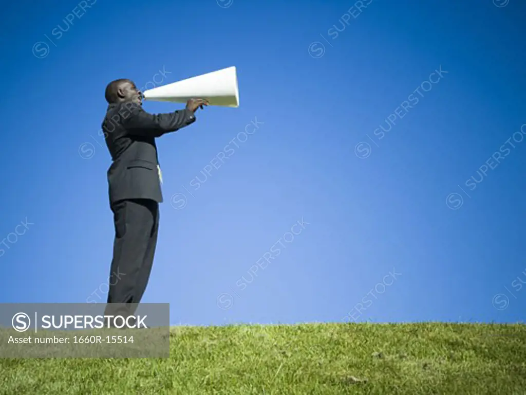 Man yelling through bullhorn