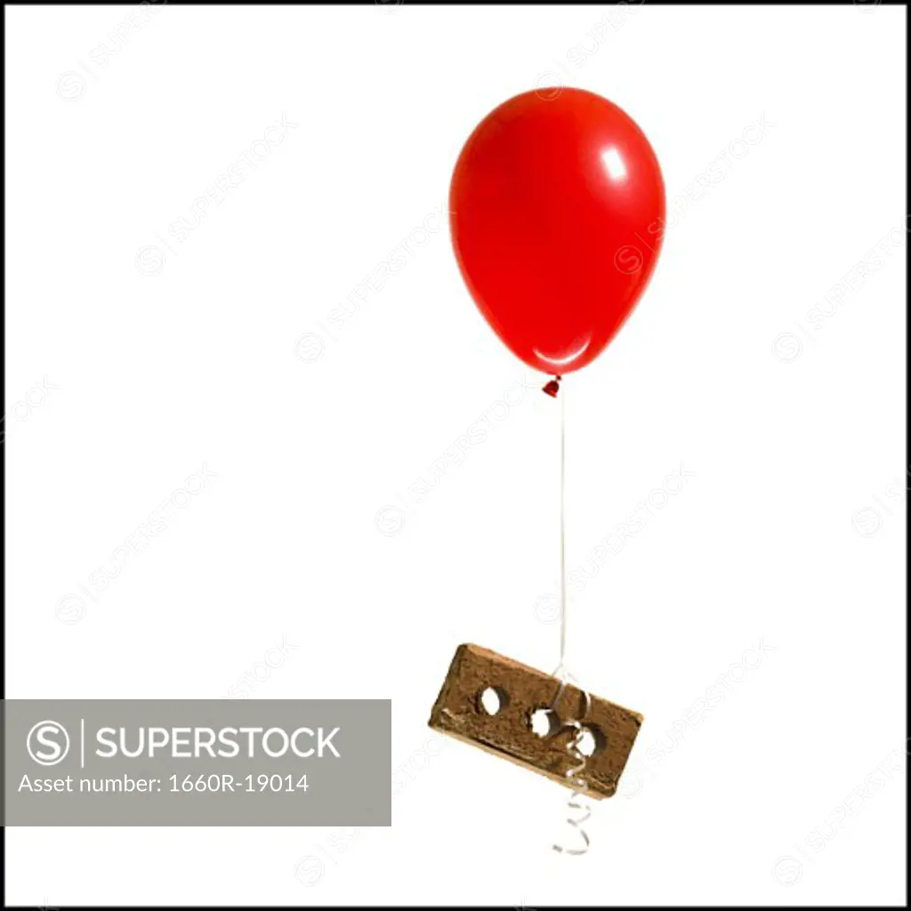 Helium balloon lifting brick